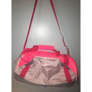 Pink Nike duffel bag.